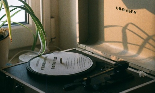 a record player by a lamp