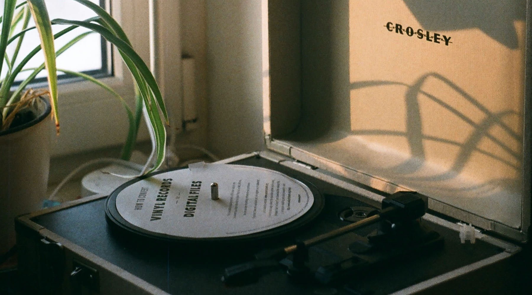 a record player by a lamp