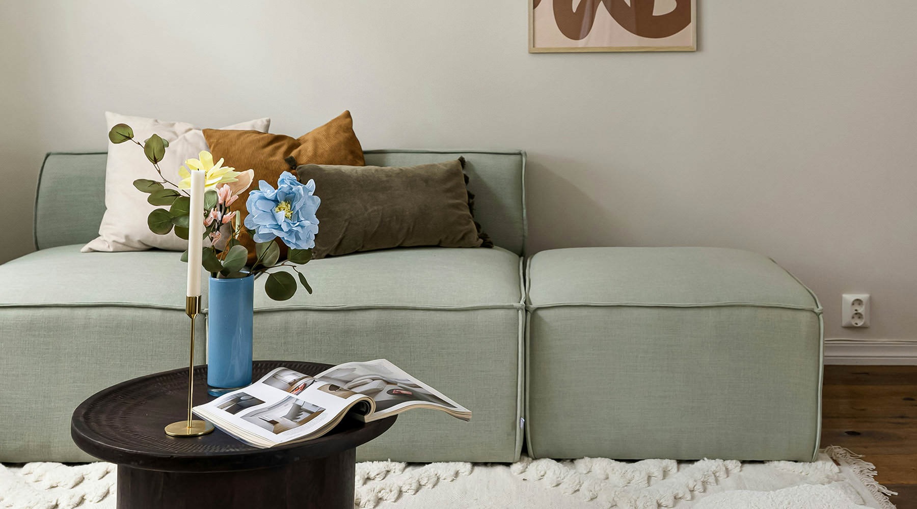a living room with a chandelier and a couch